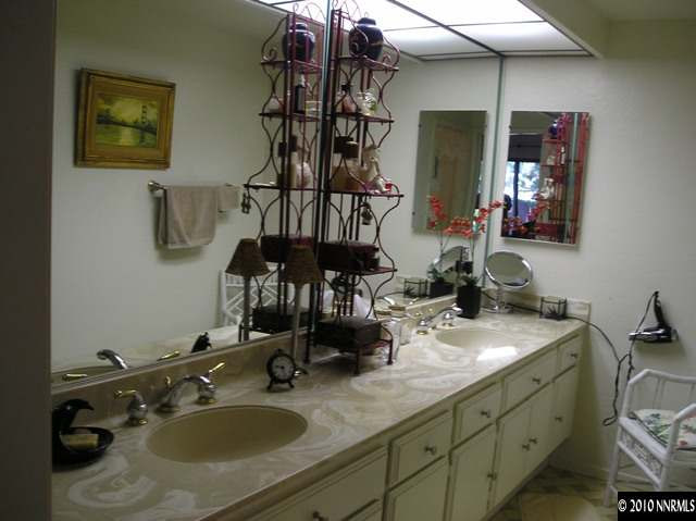 326 West Riverview Circle Reno, NV 89509 - Photo 5 of 9 a bathroom with a sink and a mirror
