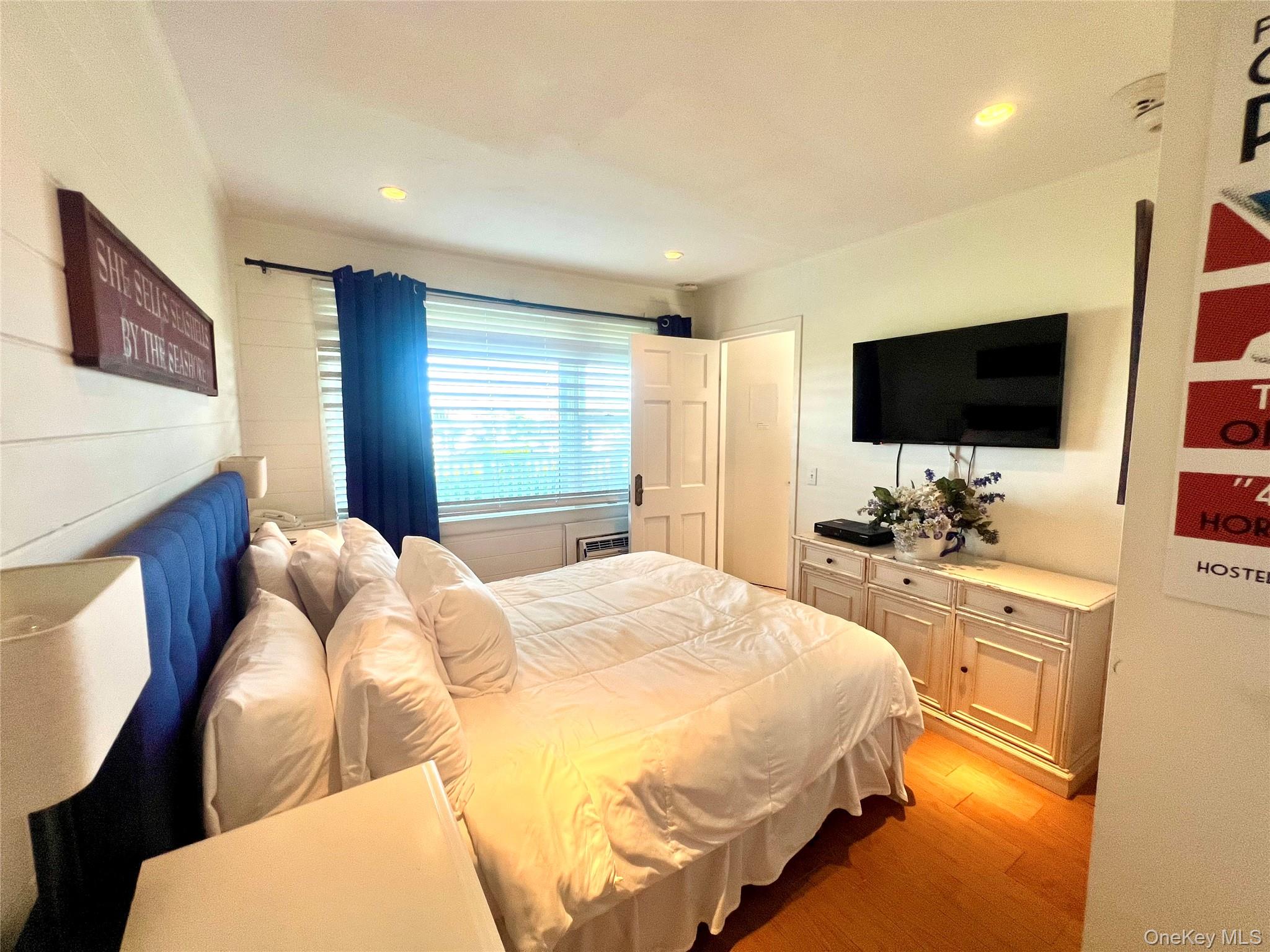 231 Dune Road, Unit 905 Westhampton Beach, NY 11978 - Photo 5 of 24 Bedroom with light wood finished floors and recessed lighting