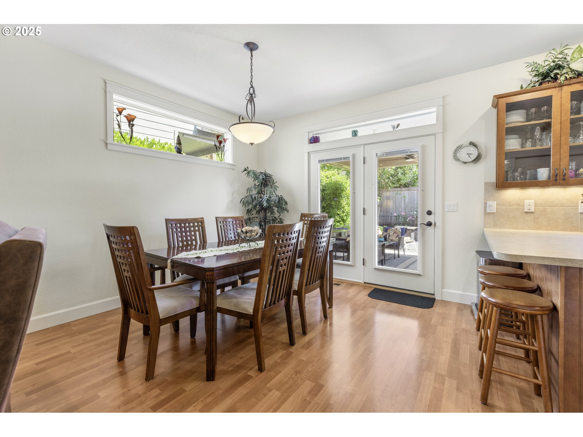 3369 Falcon Drive Springfield, OR 97477 - Photo 16 of 47 a view of a dining room with furniture a chandelier and wooden floor