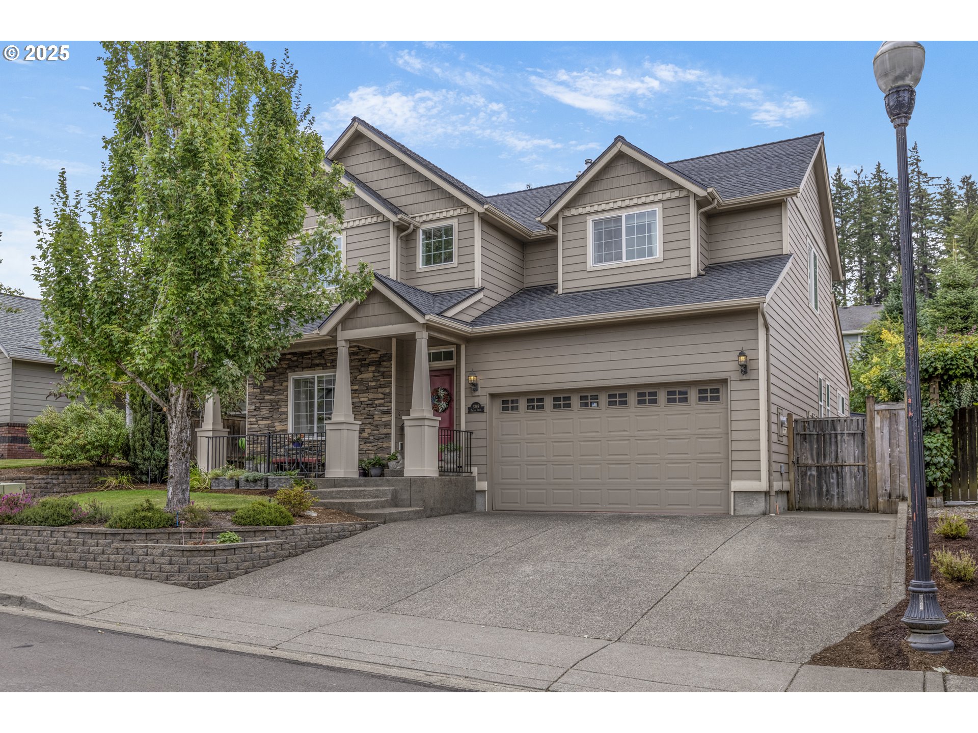 3369 Falcon Drive Springfield, OR 97477 - Photo 2 of 47 a front view of a house with a yard and garage