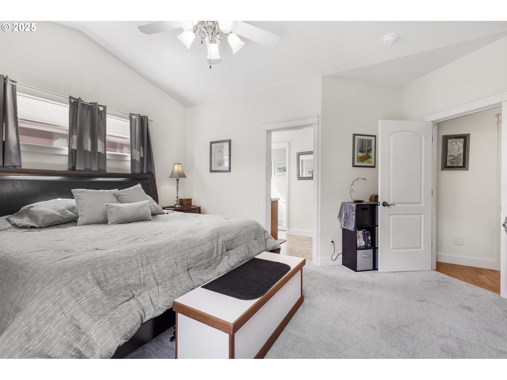 3369 Falcon Drive Springfield, OR 97477 - Photo 24 of 47 a bedroom with a bed and a chandelier