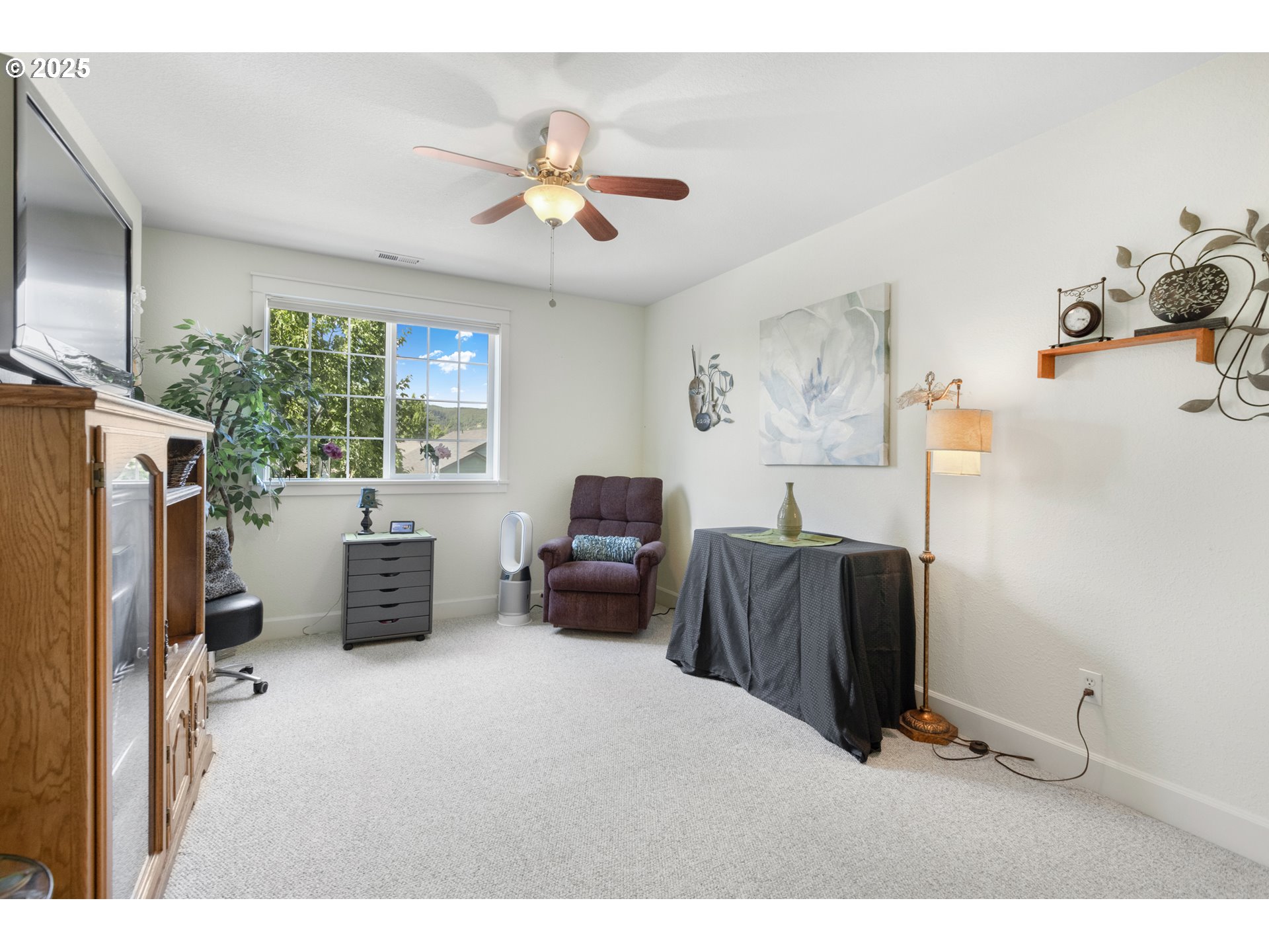 3369 Falcon Drive Springfield, OR 97477 - Photo 33 of 47 a living room with furniture and a flat screen tv