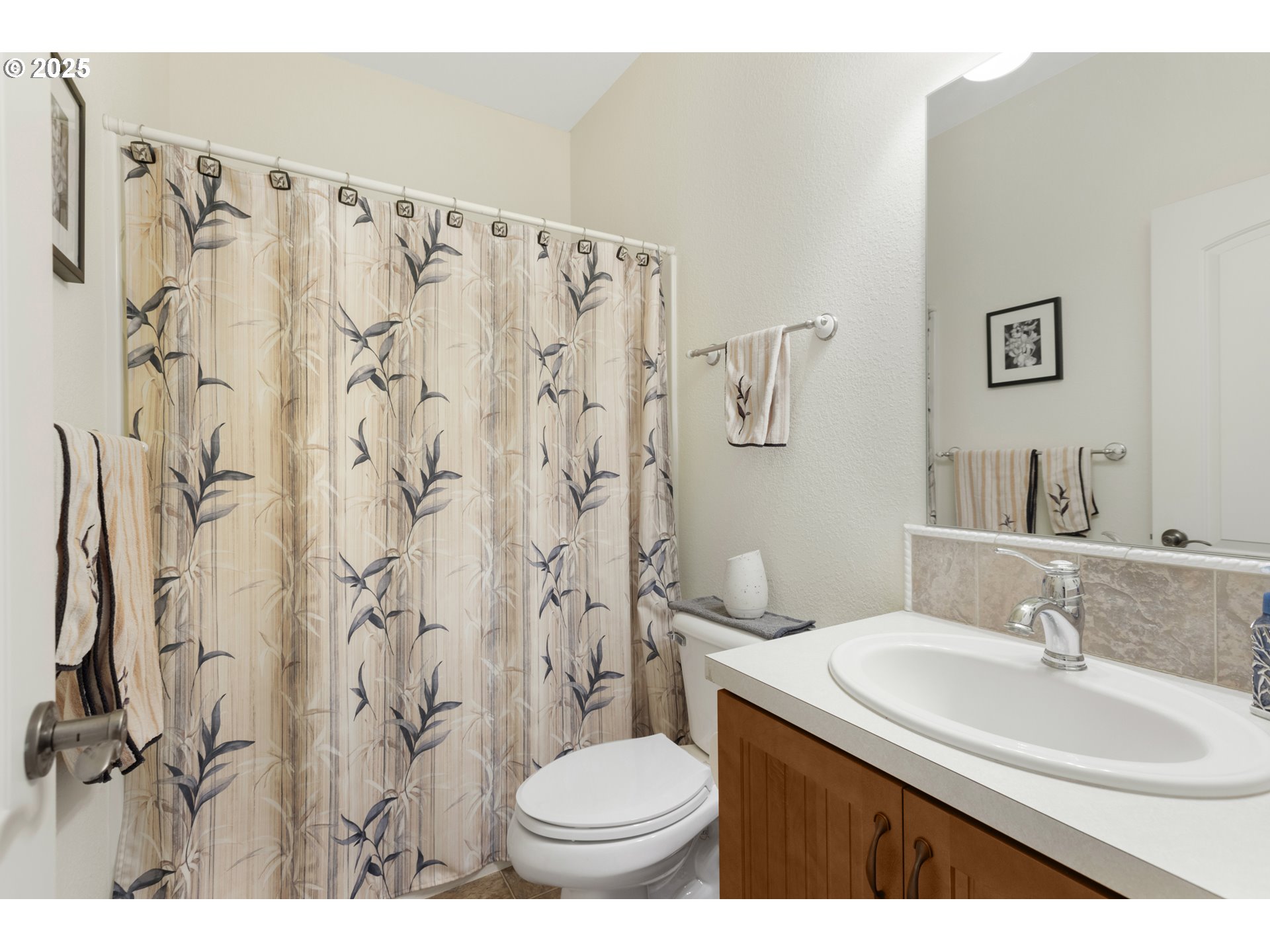 3369 Falcon Drive Springfield, OR 97477 - Photo 10 of 47 a bathroom with a sink toilet and a mirror