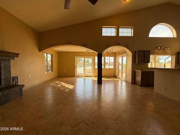 a view of empty room with a fireplace