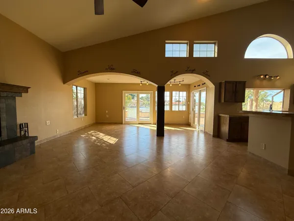 a view of empty room with a fireplace