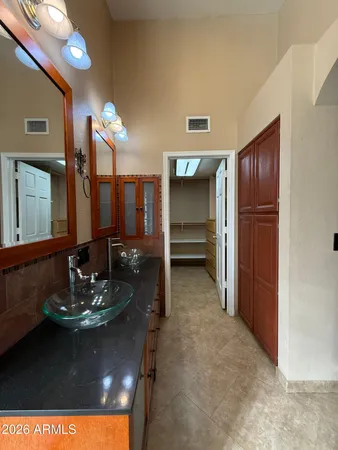 a kitchen with a sink and cabinets