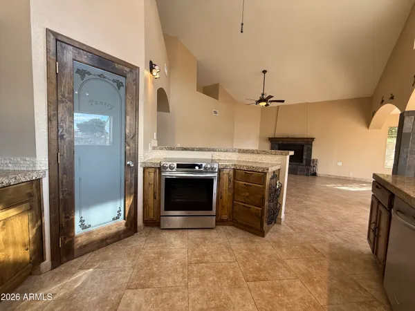a kitchen with a stove and a refrigerator