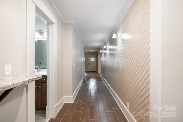 a view of gallery with wooden floor