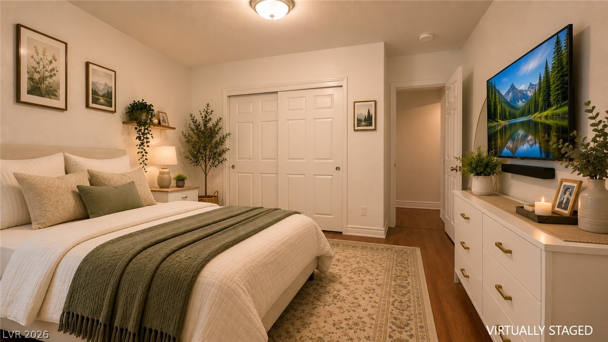 87 Tall Ruff Drive Las Vegas, NV 89148 - Photo 66 of 71 Unwind in this peaceful bedroom featuring warm wood floors and ample closet space.