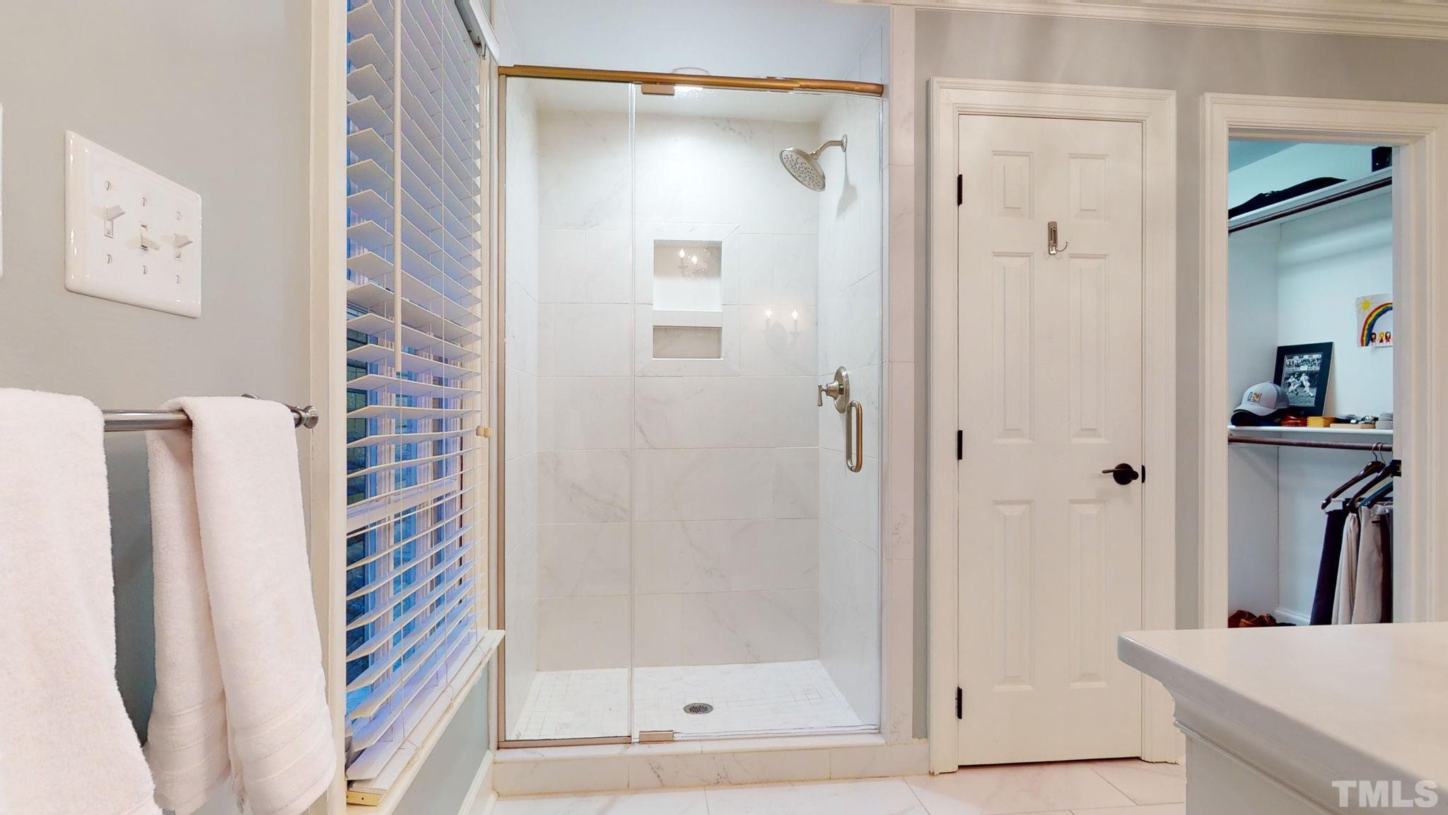 7313 Rainwater Road Raleigh, NC 27615 - Photo 19 of 30 a bathroom with a shower and a sink