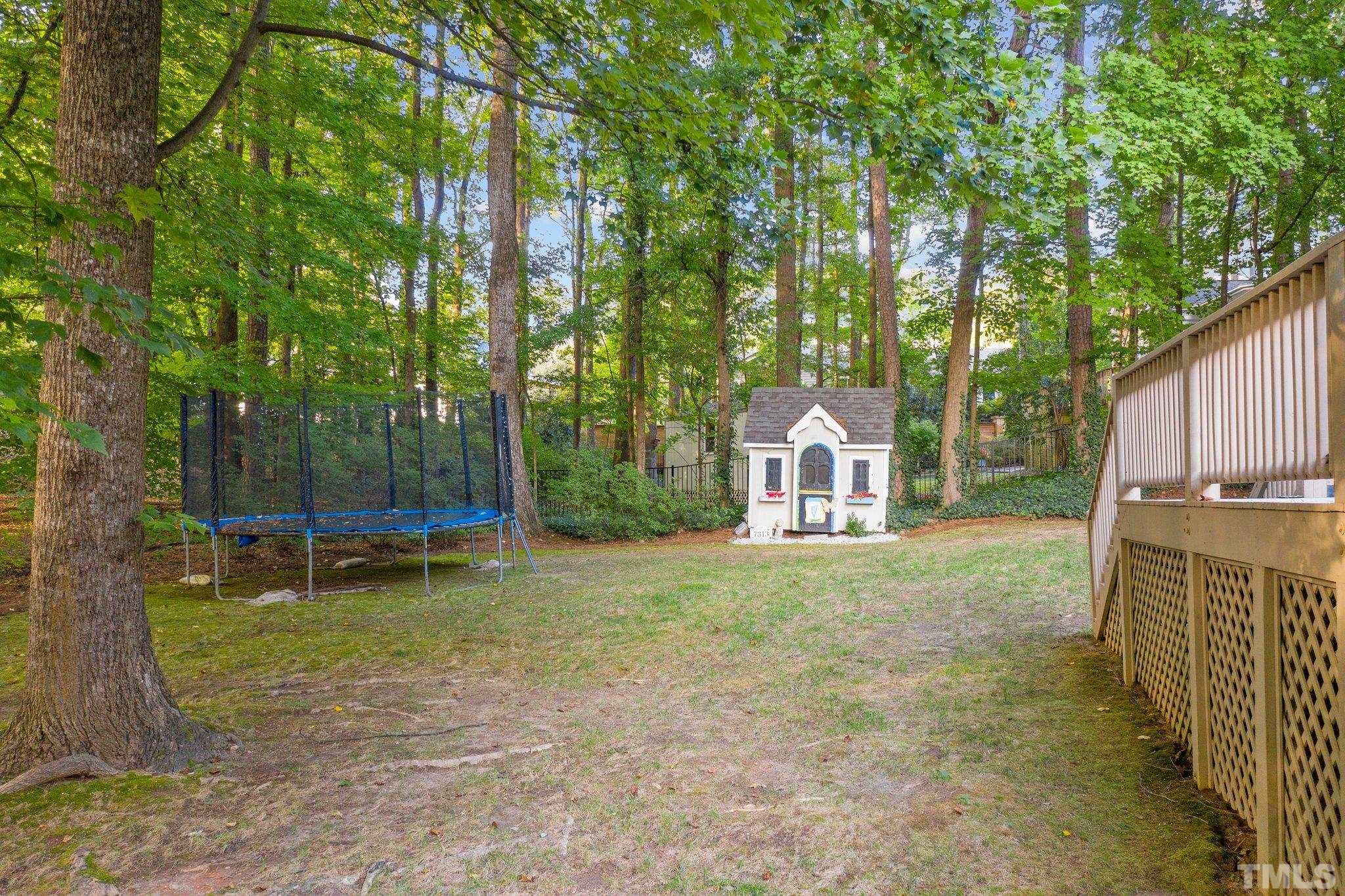 7313 Rainwater Road Raleigh, NC 27615 - Photo 28 of 30 a backyard of a house with table and chairs