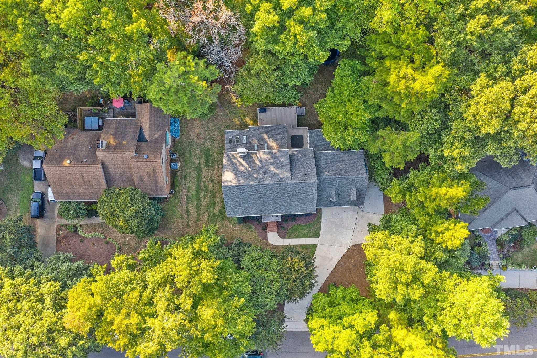 7313 Rainwater Road Raleigh, NC 27615 - Photo 30 of 30 aerial view of a house with large trees and plants