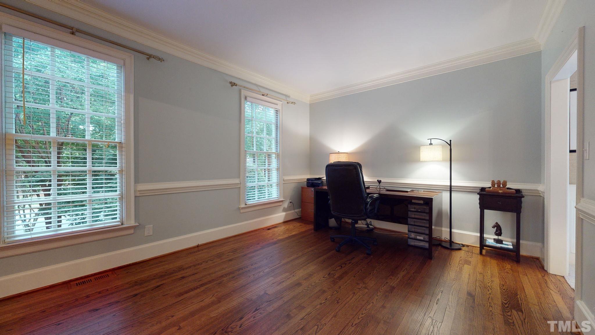 7313 Rainwater Road Raleigh, NC 27615 - Photo 5 of 30 a view of a workspace with furniture and a window