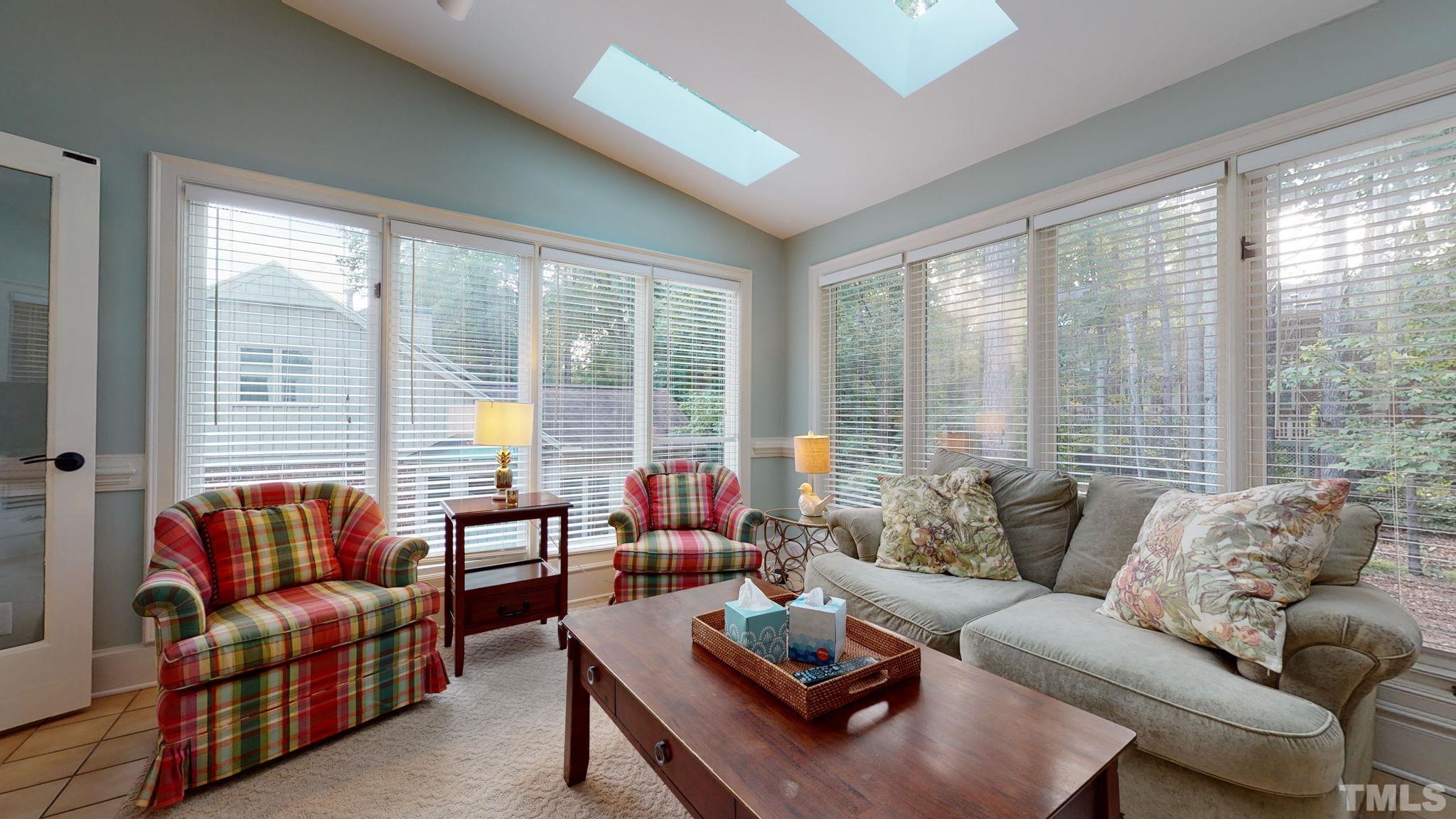 7313 Rainwater Road Raleigh, NC 27615 - Photo 9 of 30 a living room with furniture and a large window