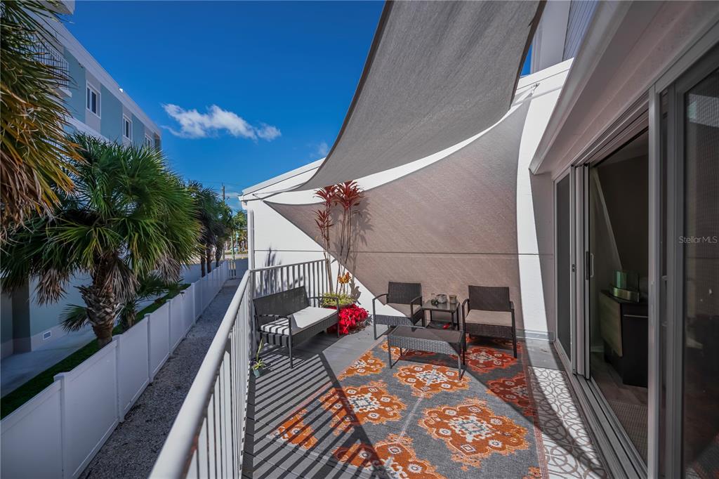 2255 North Beach Road, Unit 20 Englewood, FL 34223 - Photo 13 of 50 a balcony with furniture and a potted plant