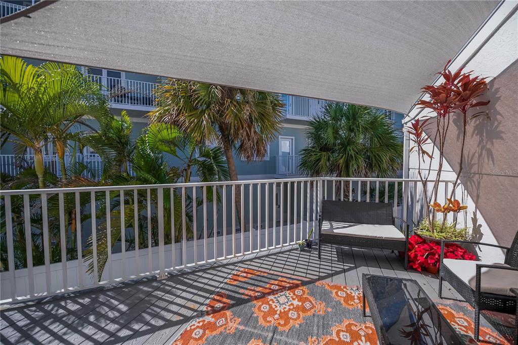 2255 North Beach Road, Unit 20 Englewood, FL 34223 - Photo 14 of 50 a view of balcony with wooden floor