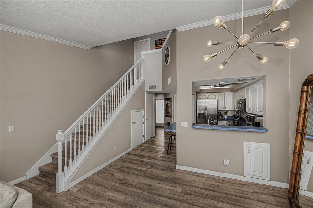 2255 North Beach Road, Unit 20 Englewood, FL 34223 - Photo 18 of 50 a view of a hallway with wooden floor and staircase