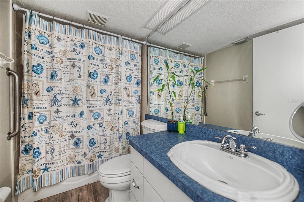 2255 North Beach Road, Unit 20 Englewood, FL 34223 - Photo 32 of 50 a bathroom with a sink toilet and shower