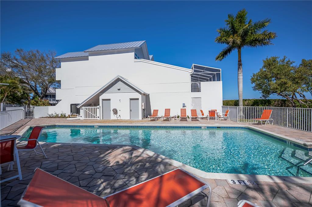 2255 North Beach Road, Unit 20 Englewood, FL 34223 - Photo 33 of 50 a view of a house with a yard and a fountain
