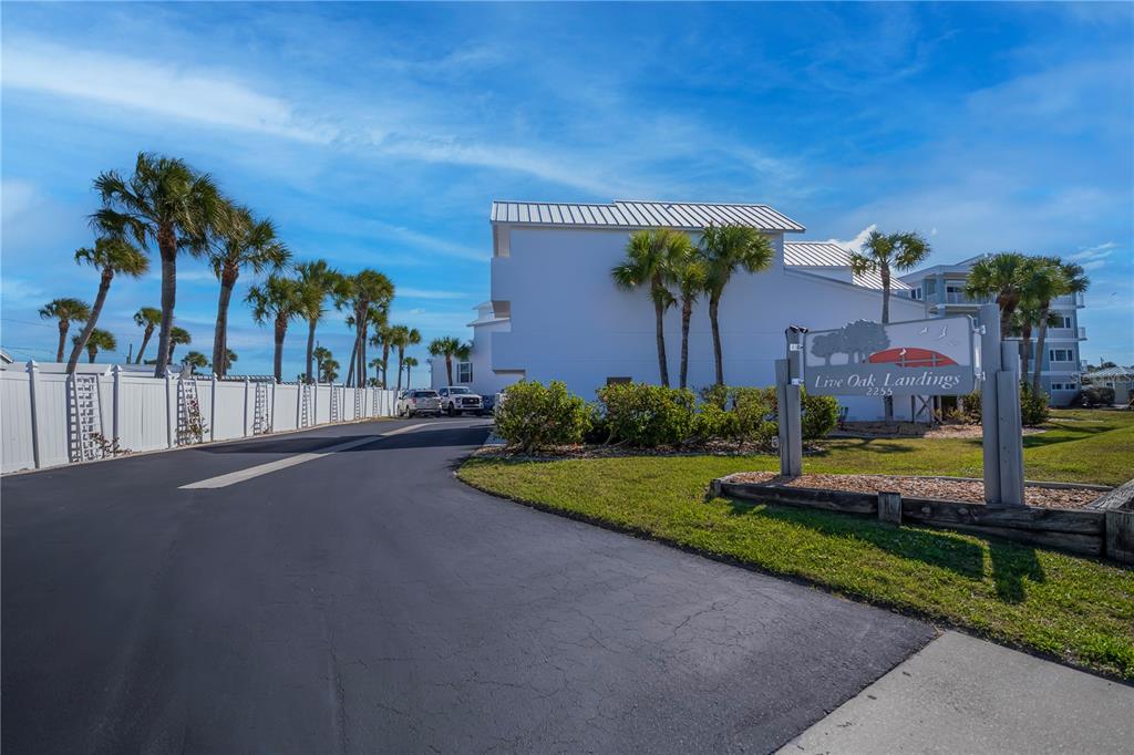 2255 North Beach Road, Unit 20 Englewood, FL 34223 - Photo 37 of 50 a view of a house with a yard and a street