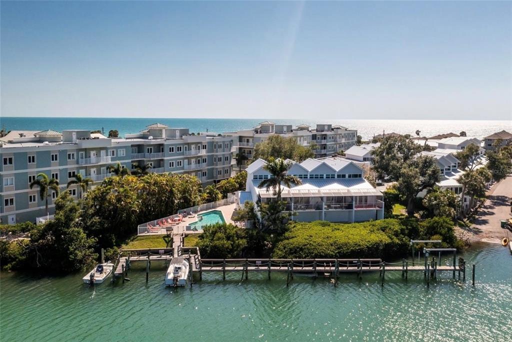2255 North Beach Road, Unit 20 Englewood, FL 34223 - Photo 7 of 50 an aerial view of a house with a garden and lake view