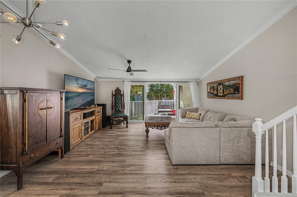 2255 North Beach Road, Unit 20 Englewood, FL 34223 - Photo 9 of 50 a living room with furniture and a flat screen tv