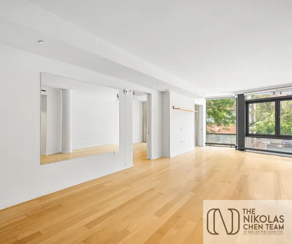a kitchen with cabinets and steel appliances