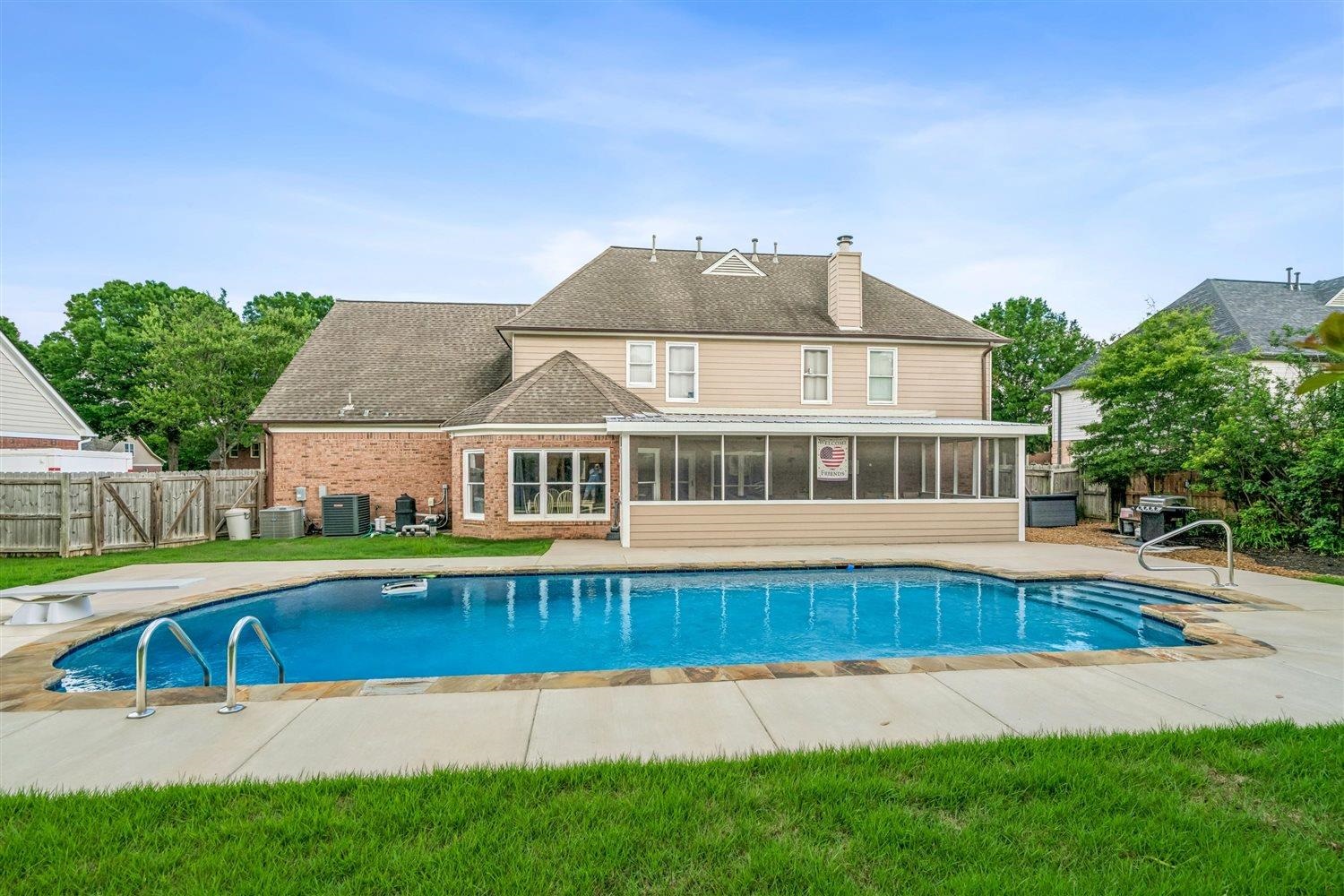 1489 John Ridge Drive Collierville, TN 38017 - Photo 36 of 39 a view of a house with pool and a yard