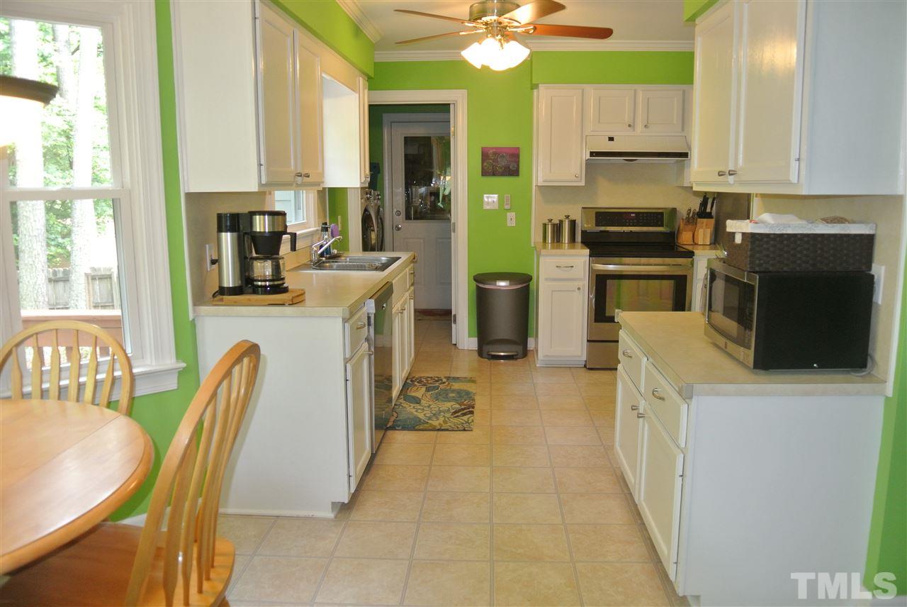 3108 Ridgestone Parkway Durham, NC 27712 - Photo 5 of 14 Kitchen with stainless steel appliances, smooth-top range & desk area. Side by side refrigerator w/ freezer on the bottom conveys.