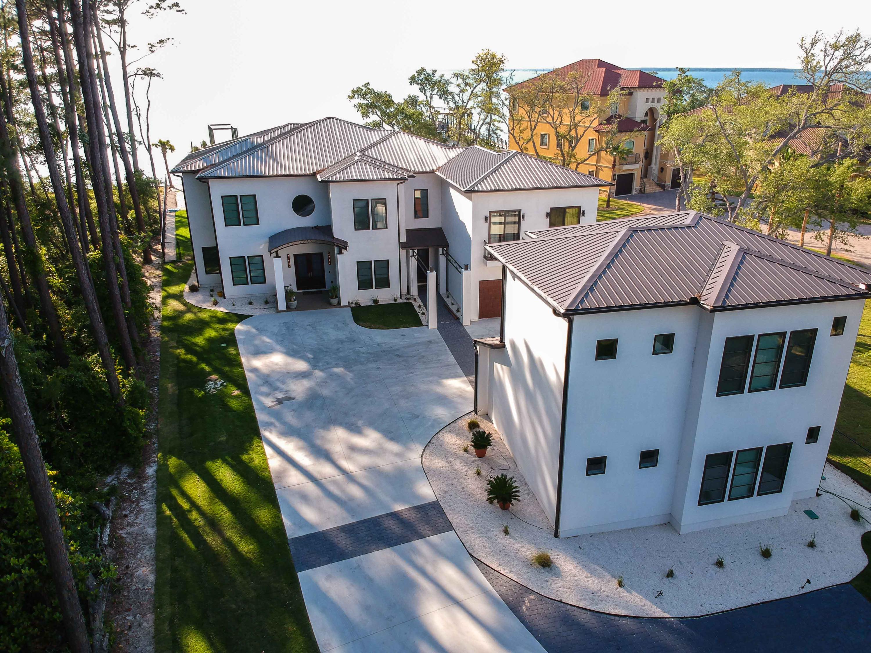 405 Driftwood Point Road Santa Rosa Beach, FL 32459 - Photo 1 of 57 a aerial view of a house with a yard balcony and mountain view