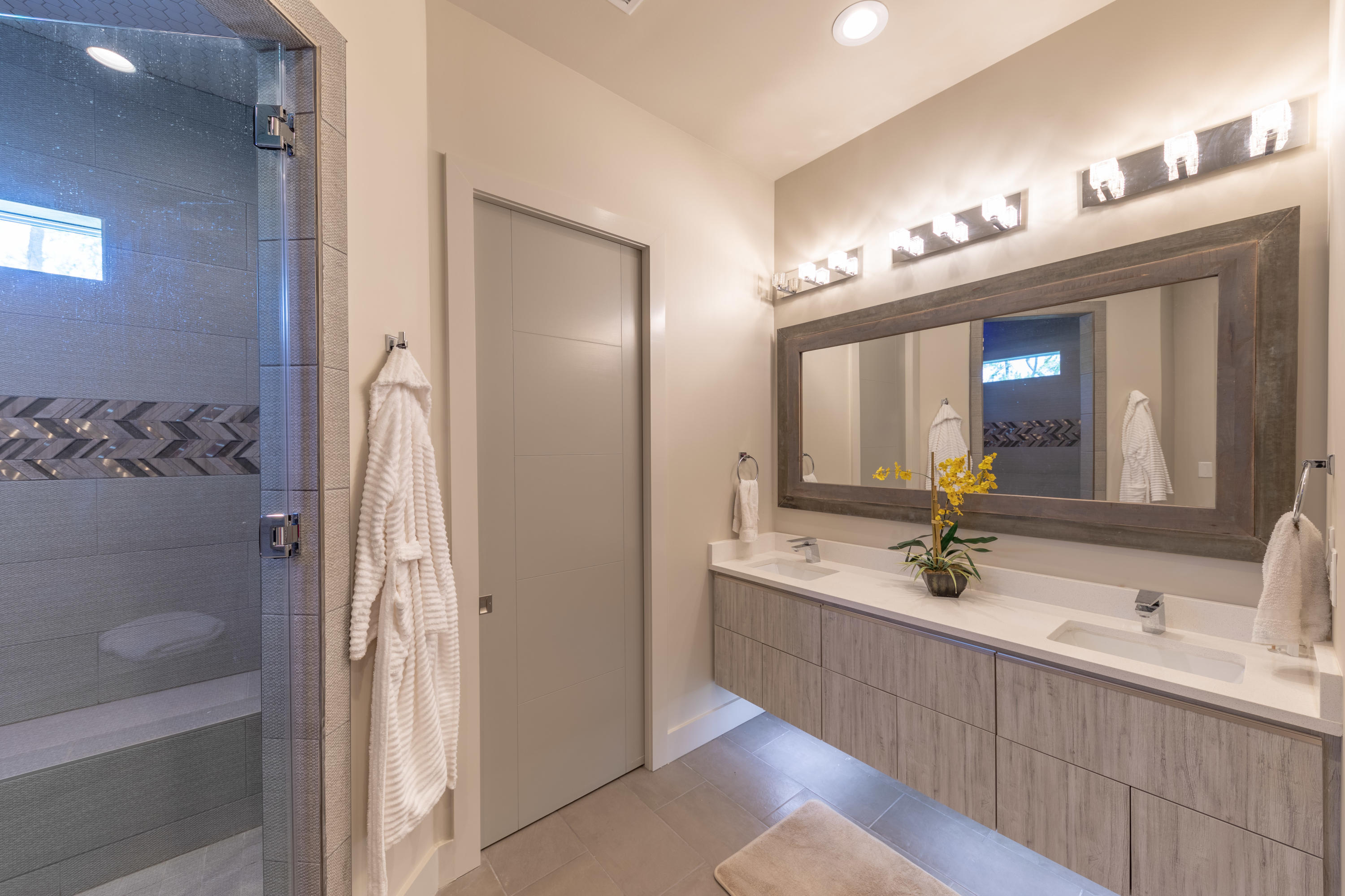 405 Driftwood Point Road Santa Rosa Beach, FL 32459 - Photo 11 of 57 a bathroom with a double vanity sink and a mirror