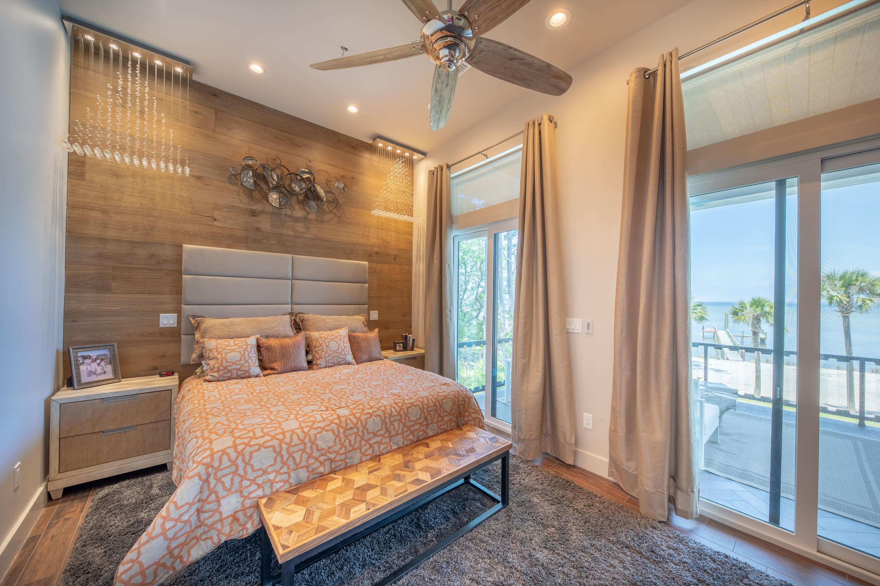 405 Driftwood Point Road Santa Rosa Beach, FL 32459 - Photo 21 of 57 a bedroom with a large bed and a chandelier