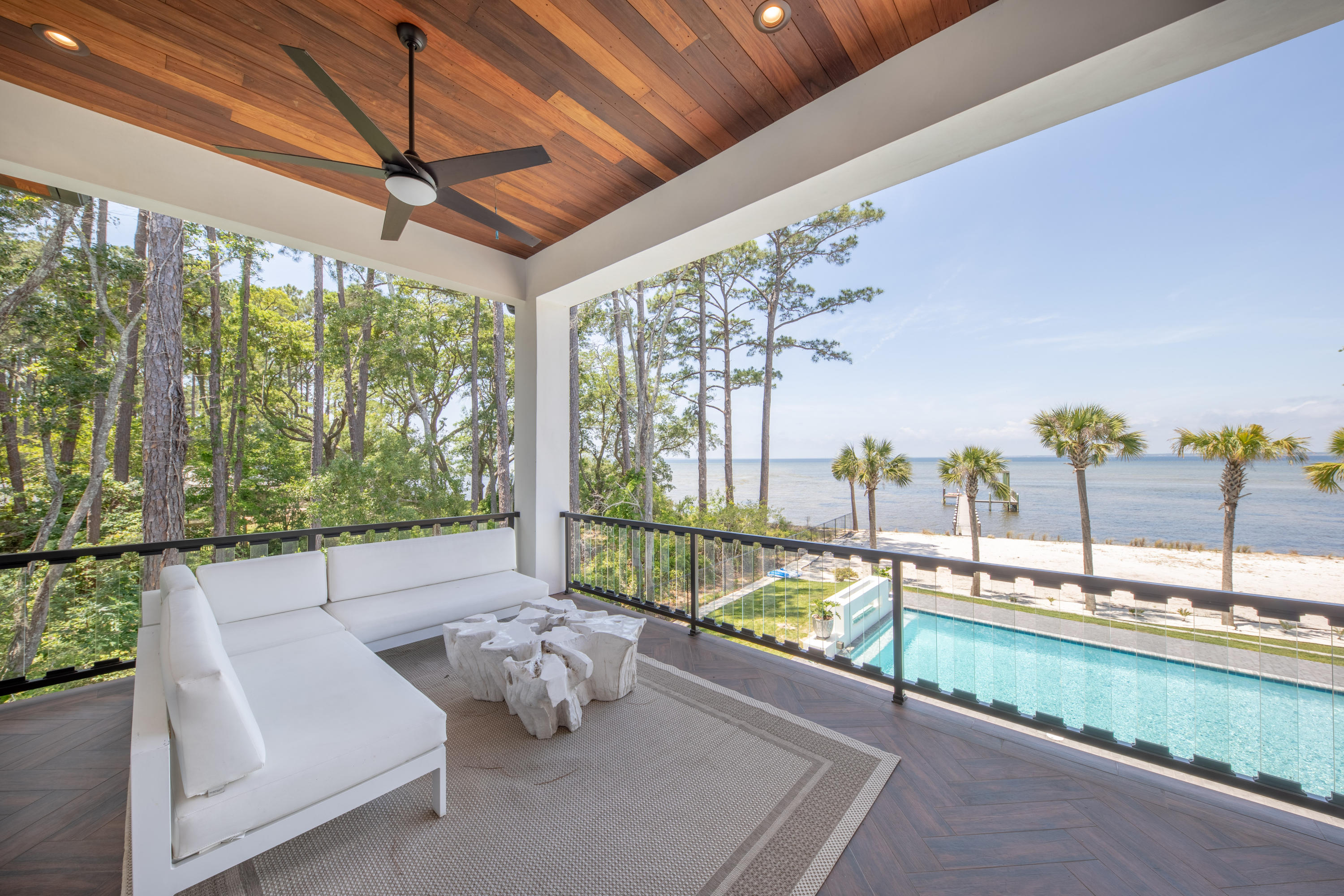 405 Driftwood Point Road Santa Rosa Beach, FL 32459 - Photo 22 of 57 a balcony with furniture and a garden