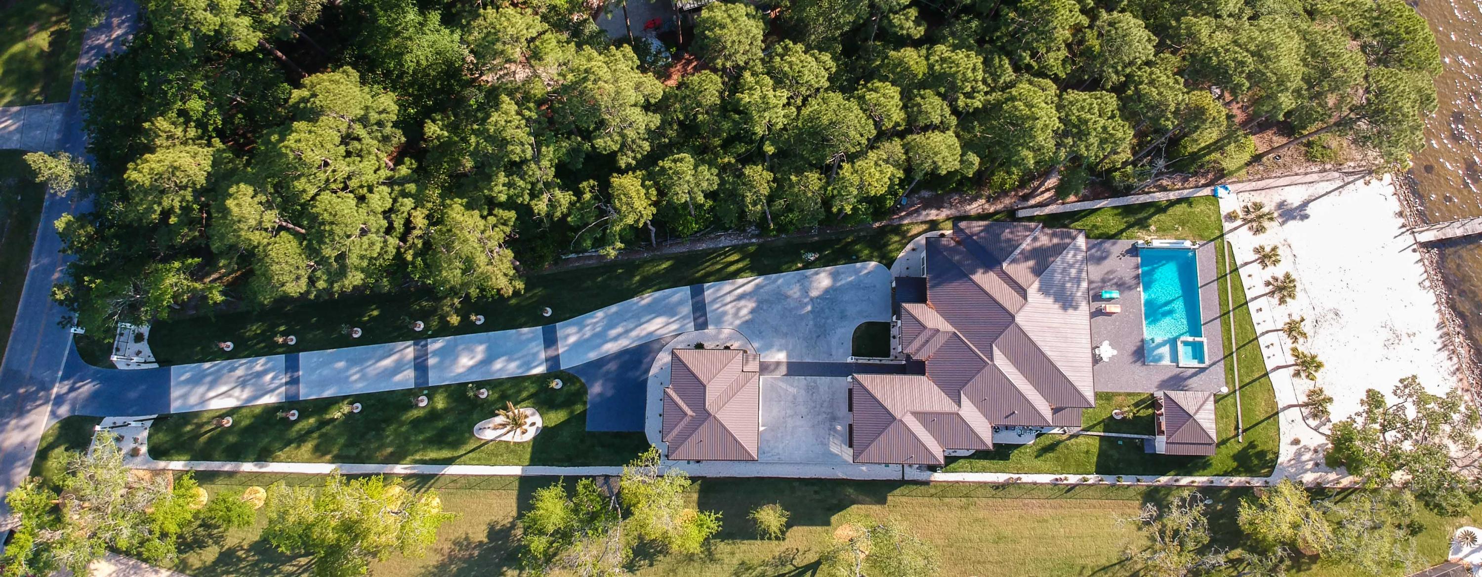 405 Driftwood Point Road Santa Rosa Beach, FL 32459 - Photo 43 of 57 an aerial view of a house with swimming pool and a yard