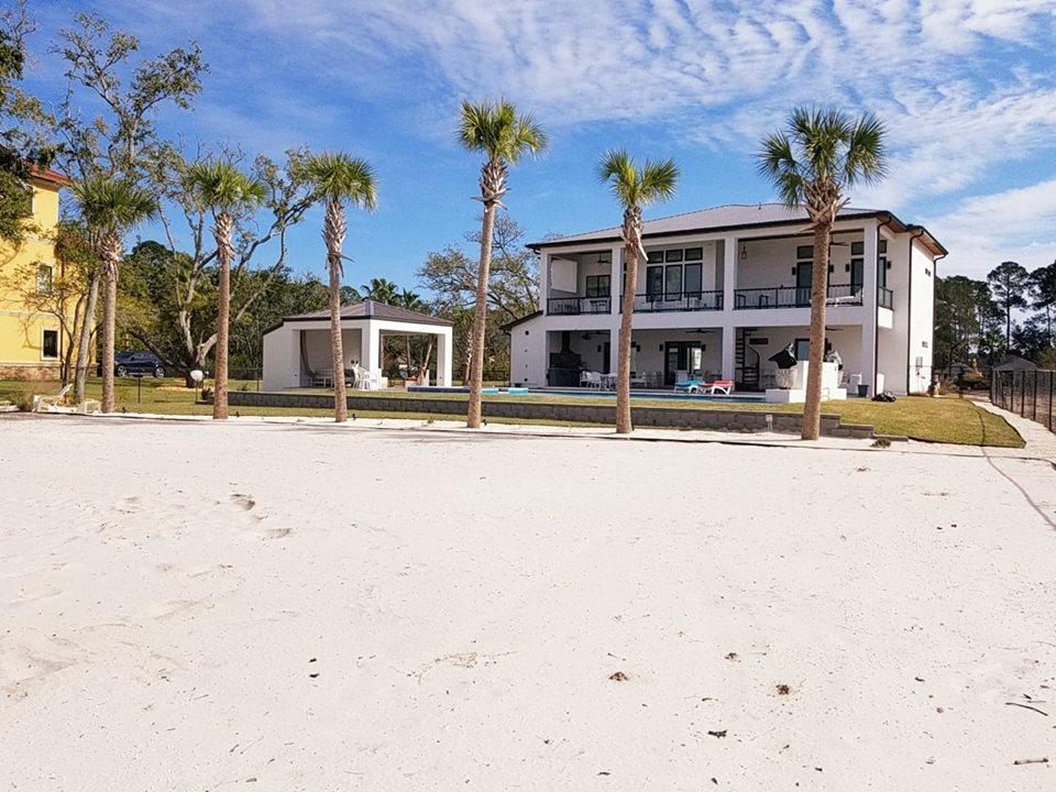 405 Driftwood Point Road Santa Rosa Beach, FL 32459 - Photo 55 of 57 a front view of a building with streets and trees