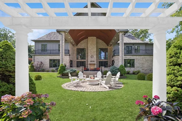 a view of a big yard with a house in the background