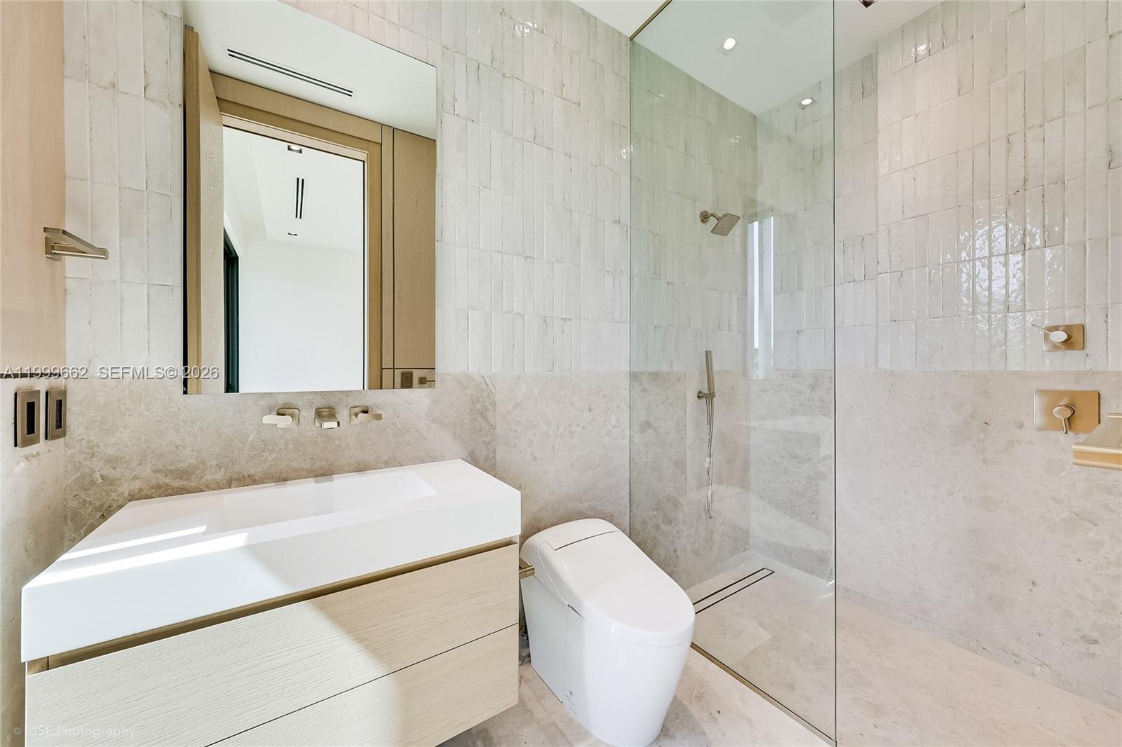 770 Lake Road Miami, FL 33137 - Photo 22 of 39 a bathroom with a sink toilet and shower