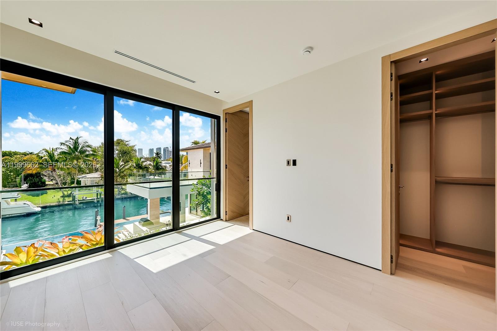 770 Lake Road Miami, FL 33137 - Photo 23 of 39 a view of a room with a large window and wooden floor