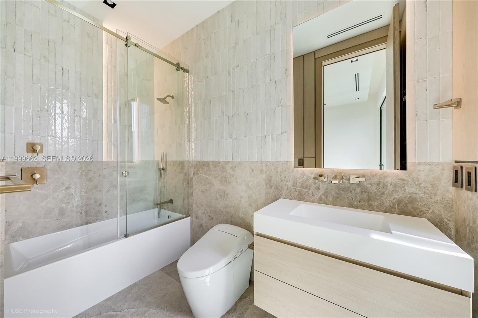 770 Lake Road Miami, FL 33137 - Photo 25 of 39 a bathroom with a granite countertop sink and a bathtub
