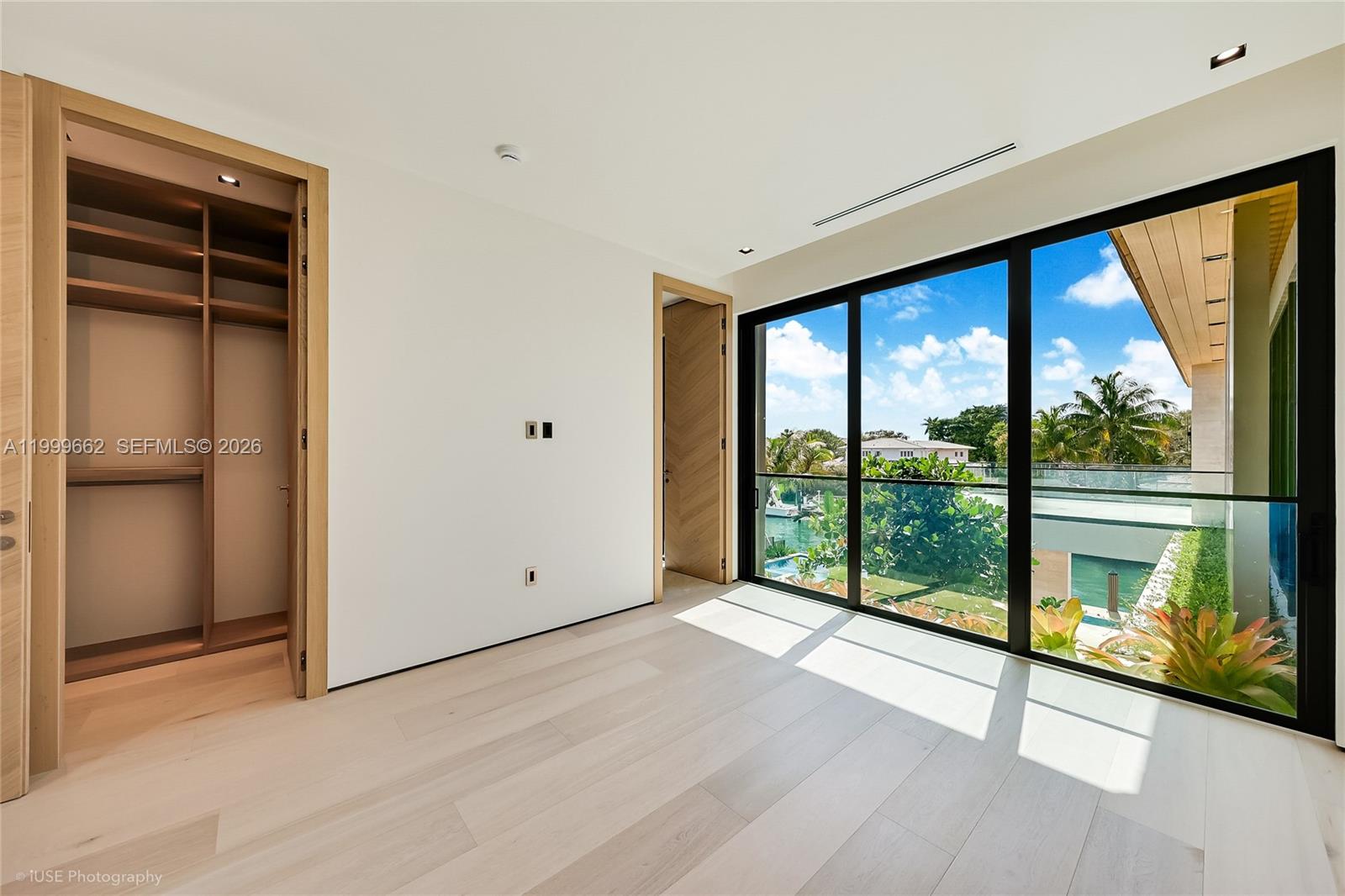770 Lake Road Miami, FL 33137 - Photo 26 of 39 a view of an empty room with wooden floor and a window