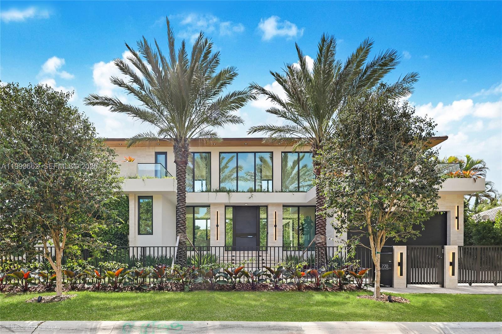 770 Lake Road Miami, FL 33137 - Photo 38 of 39 a front view of a house with a garden