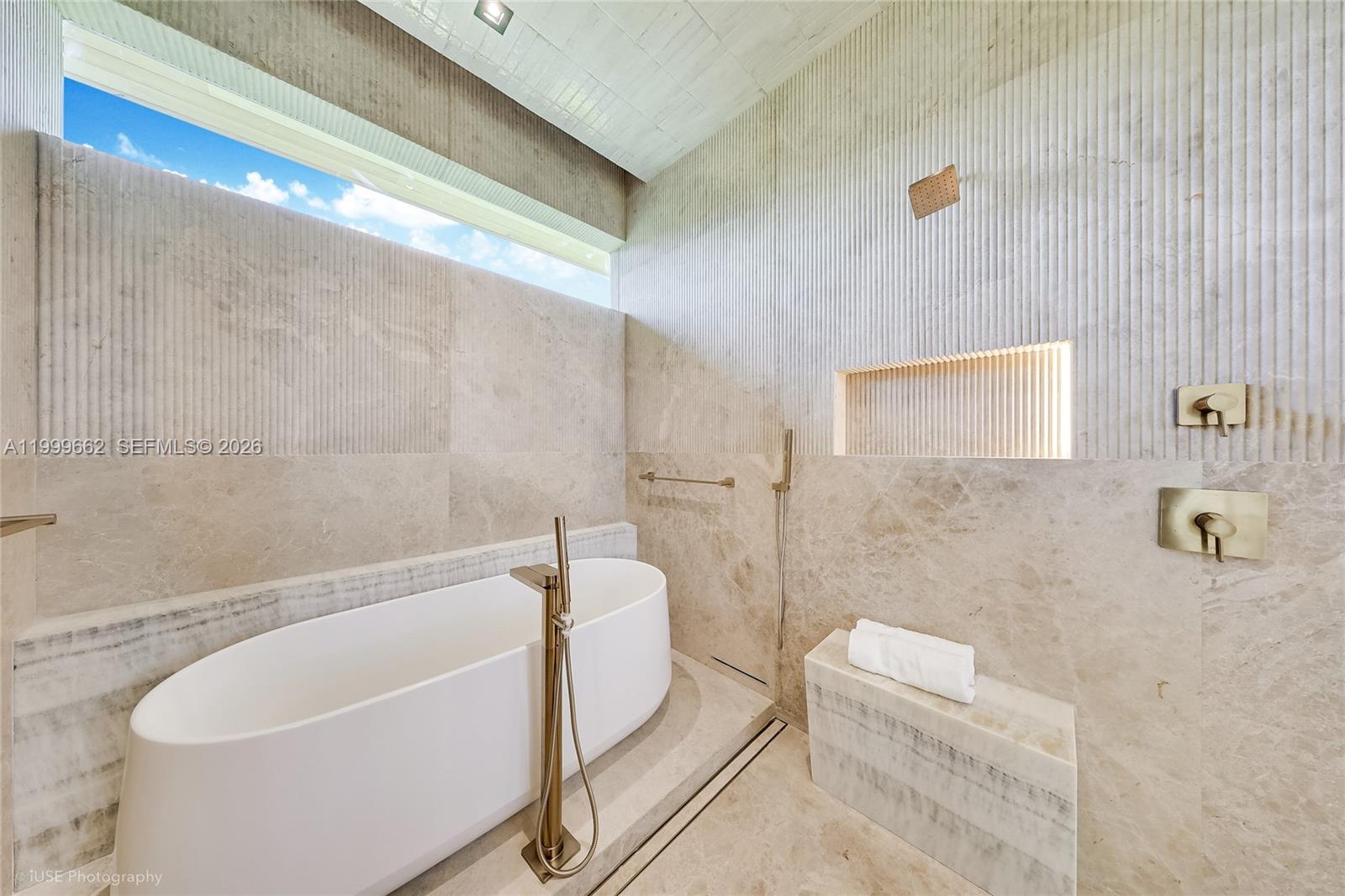 770 Lake Road Miami, FL 33137 - Photo 10 of 39 a bathroom with a white bath tub a toilet and a sink