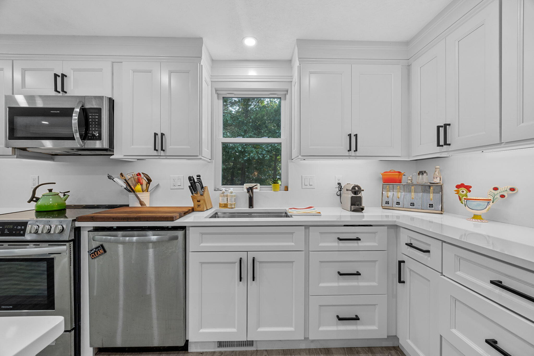 140 Noisy Hole Road Mashpee, MA 02649 - Photo 12 of 53 a kitchen with granite countertop a sink cabinets and stainless steel appliances