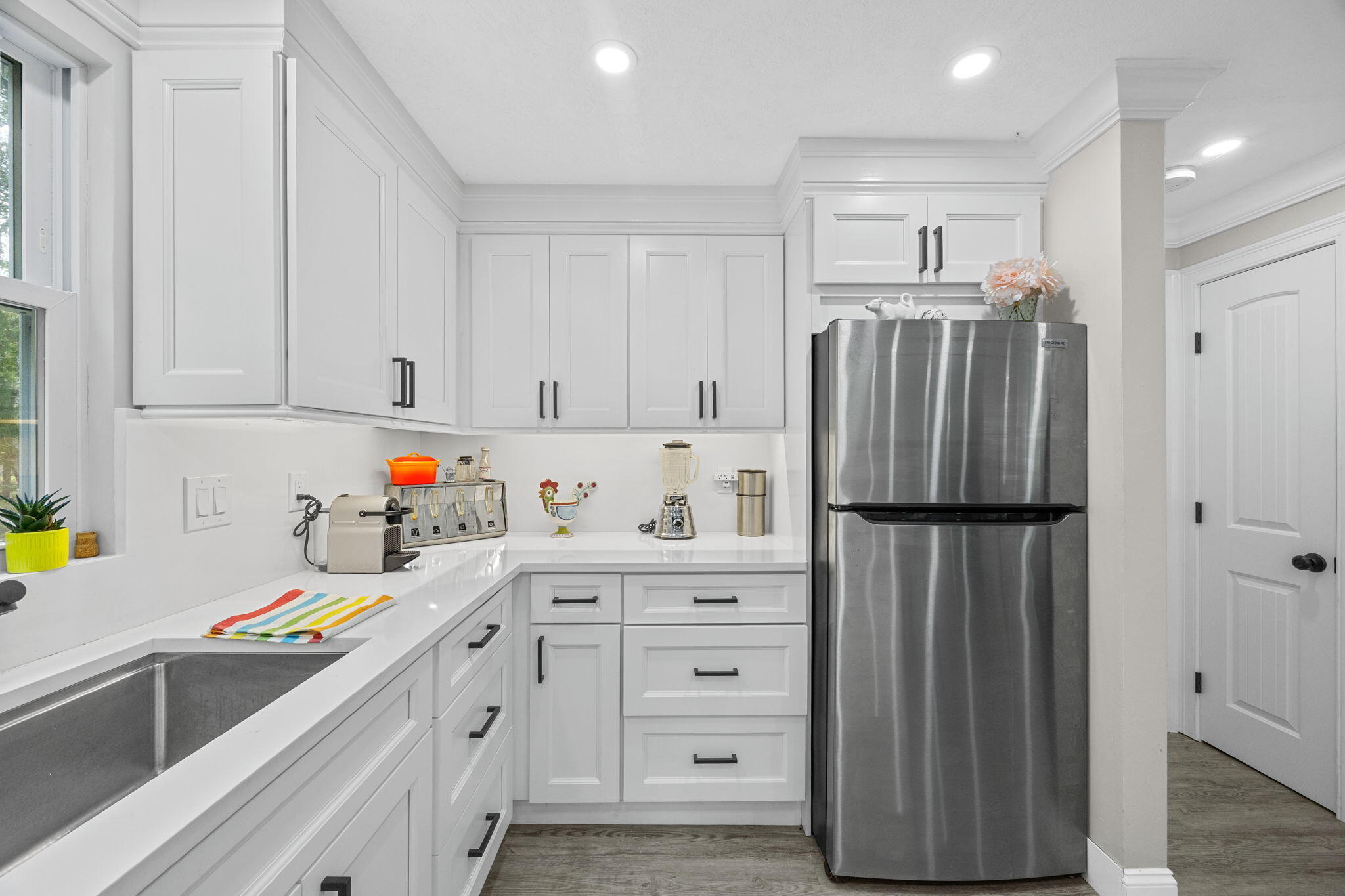 140 Noisy Hole Road Mashpee, MA 02649 - Photo 14 of 53 a kitchen with refrigerator and cabinets