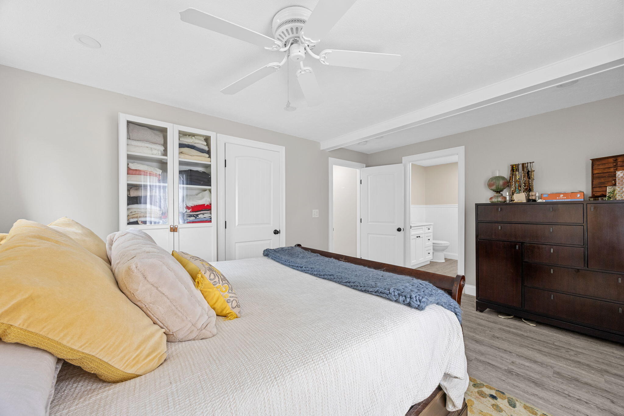 140 Noisy Hole Road Mashpee, MA 02649 - Photo 18 of 53 a spacious bedroom with a bed and a dresser
