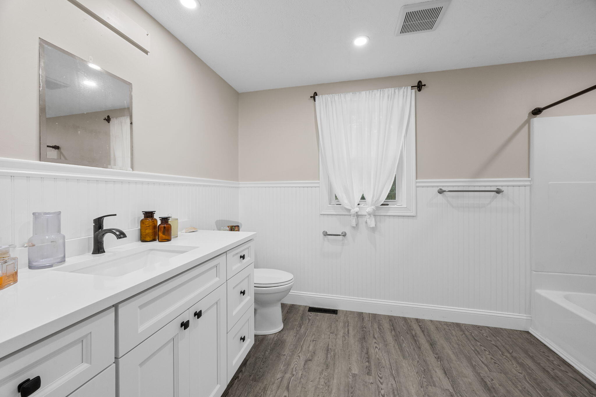 140 Noisy Hole Road Mashpee, MA 02649 - Photo 19 of 53 a bathroom with a sink a toilet and a mirror