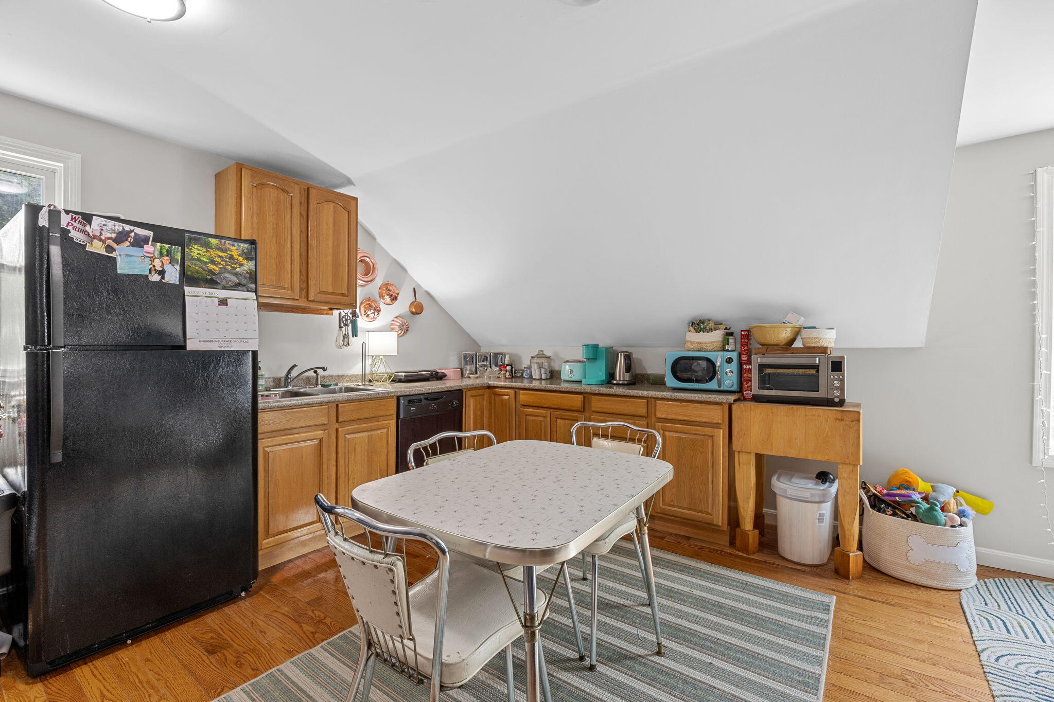 140 Noisy Hole Road Mashpee, MA 02649 - Photo 30 of 53 a view of a dining room with furniture and wooden floor