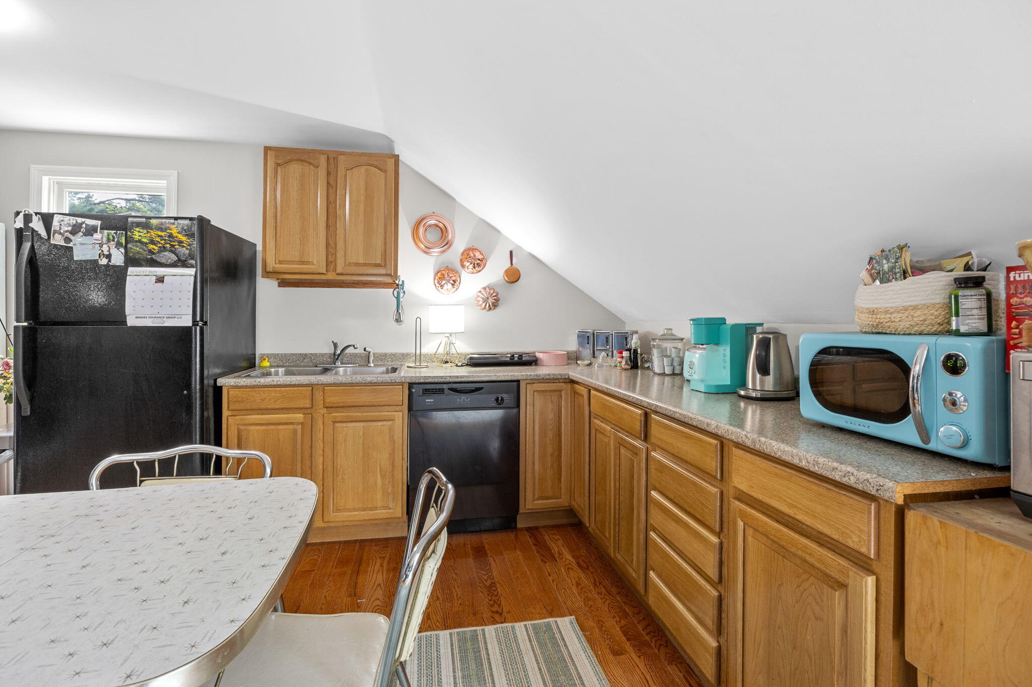 140 Noisy Hole Road Mashpee, MA 02649 - Photo 31 of 53 a kitchen with stainless steel appliances granite countertop a refrigerator a stove and a sink with wooden floor