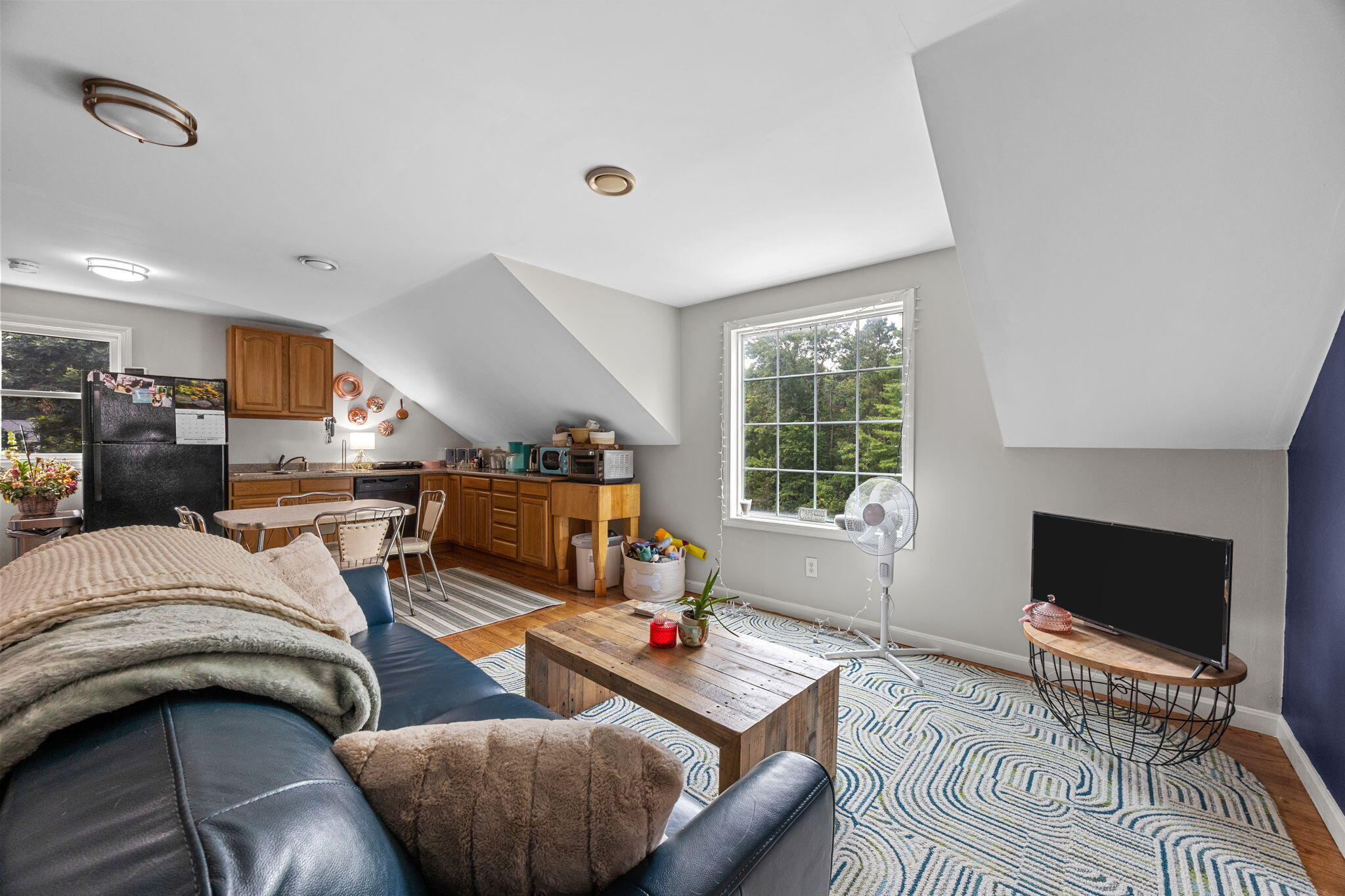 140 Noisy Hole Road Mashpee, MA 02649 - Photo 33 of 53 a living room with furniture and a flat screen tv