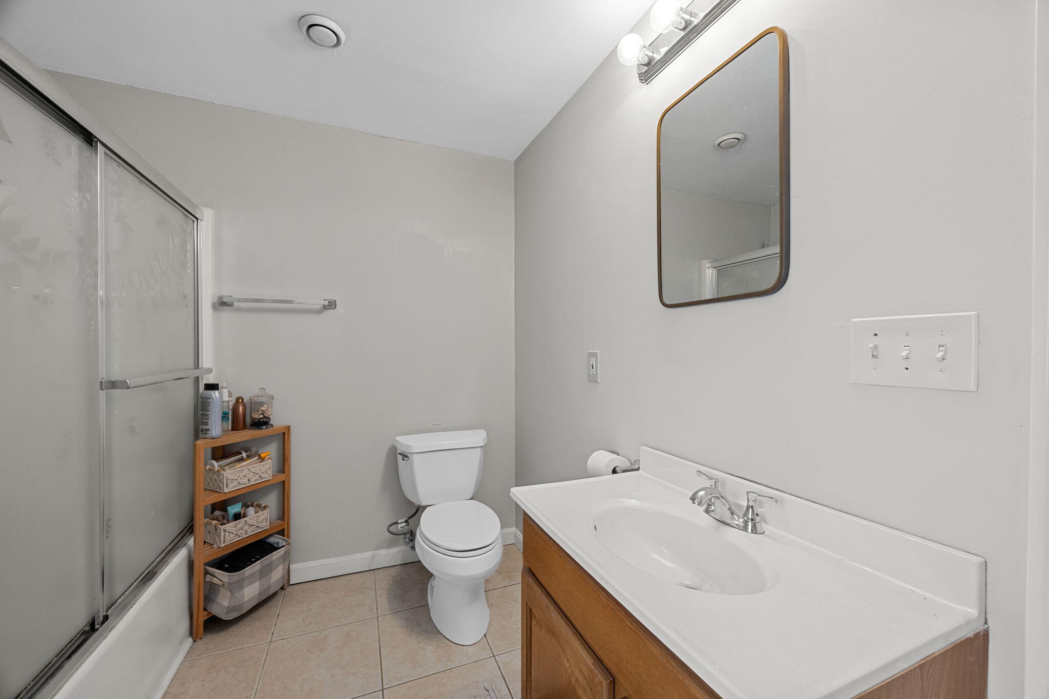 140 Noisy Hole Road Mashpee, MA 02649 - Photo 35 of 53 a bathroom with a sink a toilet and a mirror